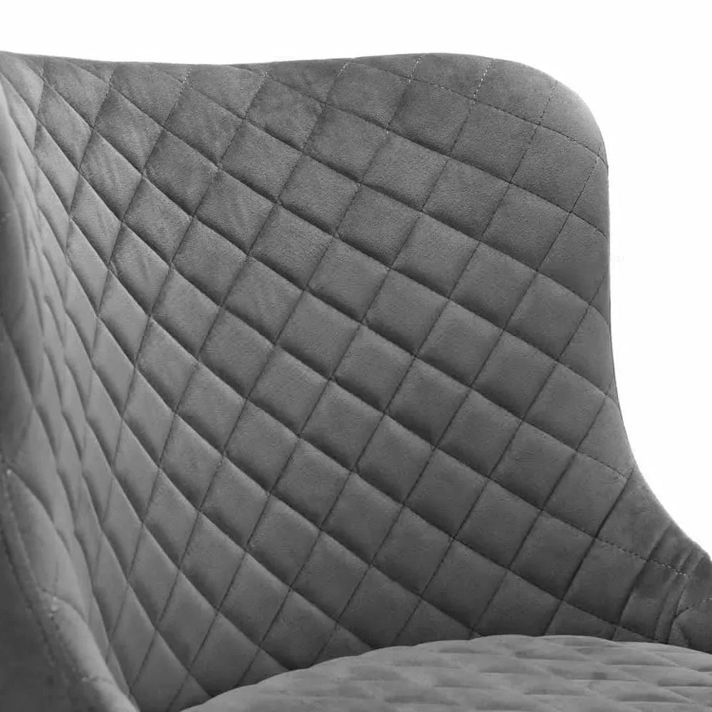 Grey fabric chair with diamond quilted upholstery, close-up of backrest and seat