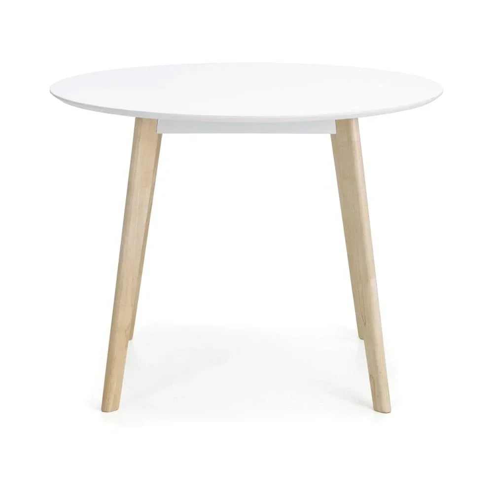 Round white dining table with light wood legs, modern minimalist style