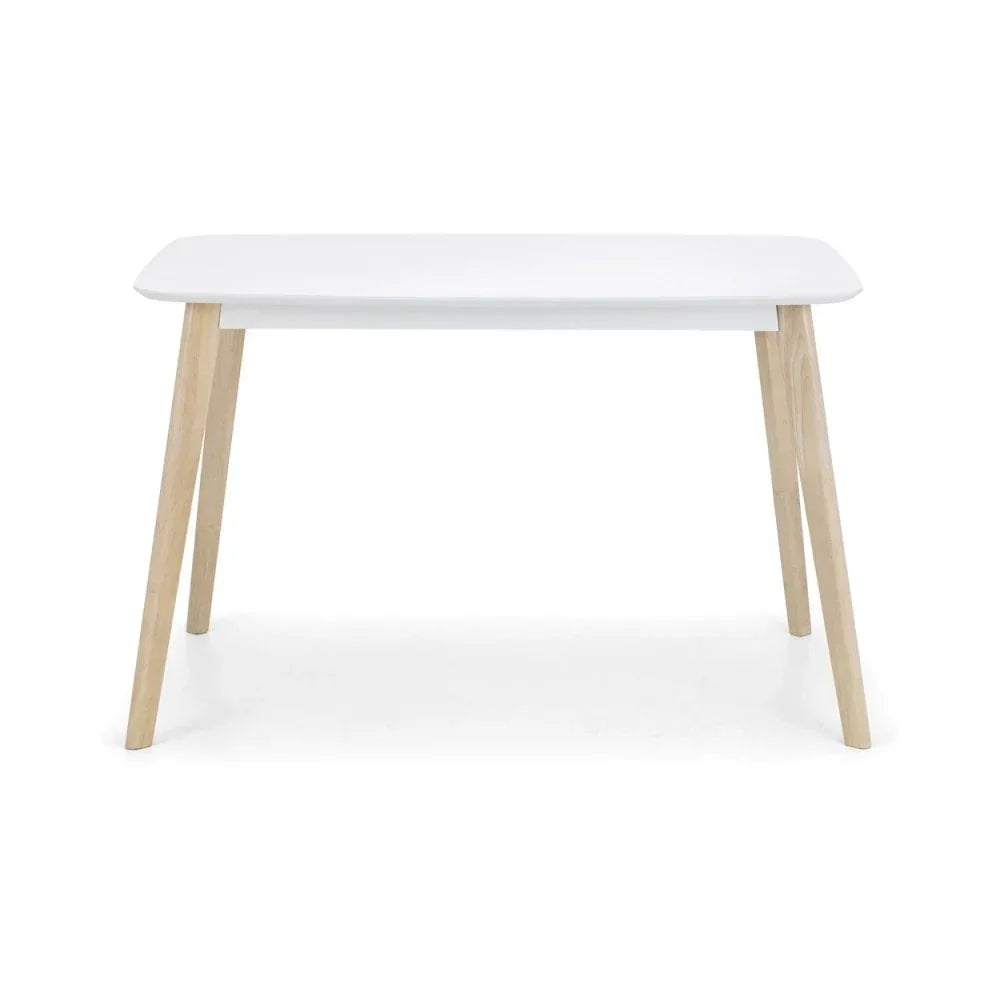 White dining table with light wood legs, minimalist modern design, front view
