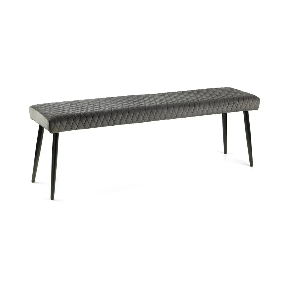 Grey quilted dining bench with black metal legs on white background