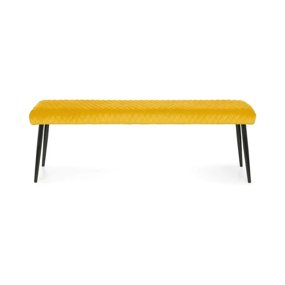 Yellow upholstered dining bench with quilted seat and black metal legs, front view