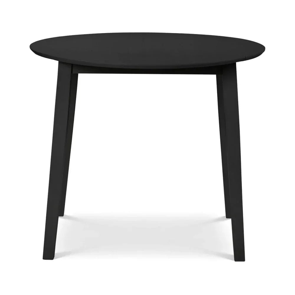 Black round dining table with four angled wooden legs, front angle view