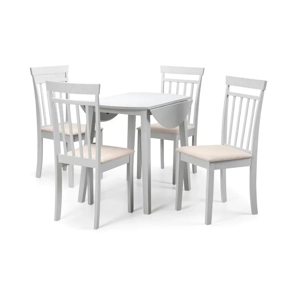 White dining table with drop-leaf sides and four matching chairs with cream seat cushions