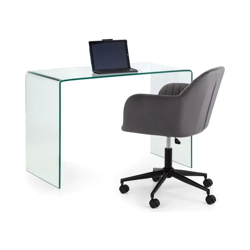 Glass office desk with laptop and grey swivel chair on white background