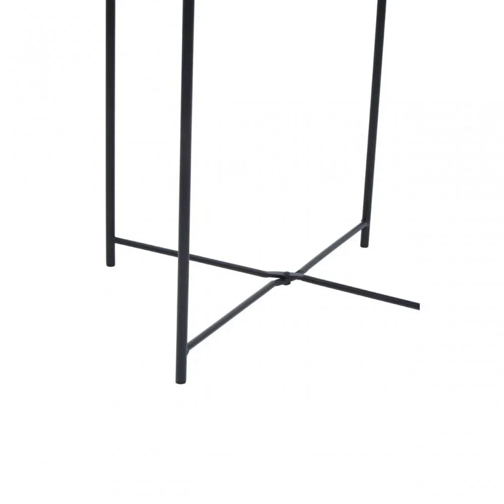 Black metal table legs with crossbar support, close-up view of furniture base