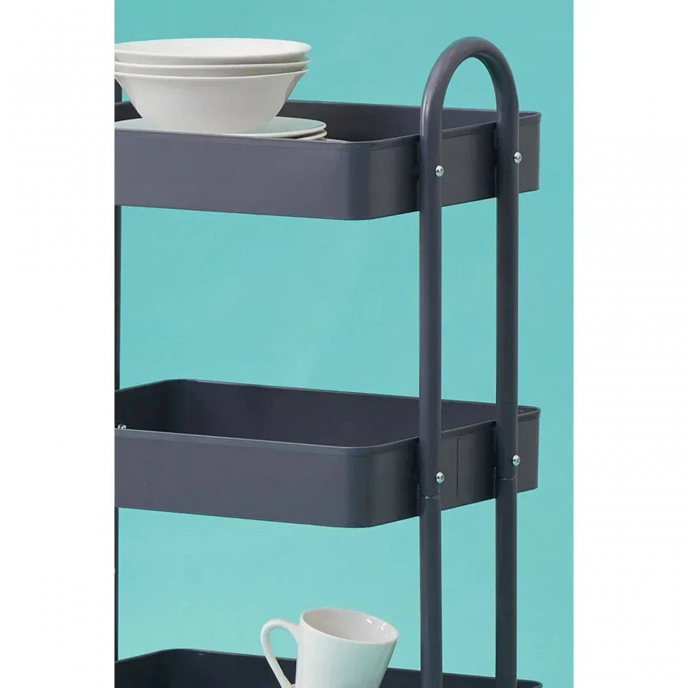 Grey metal kitchen storage trolley with three shelves holding bowls and a mug