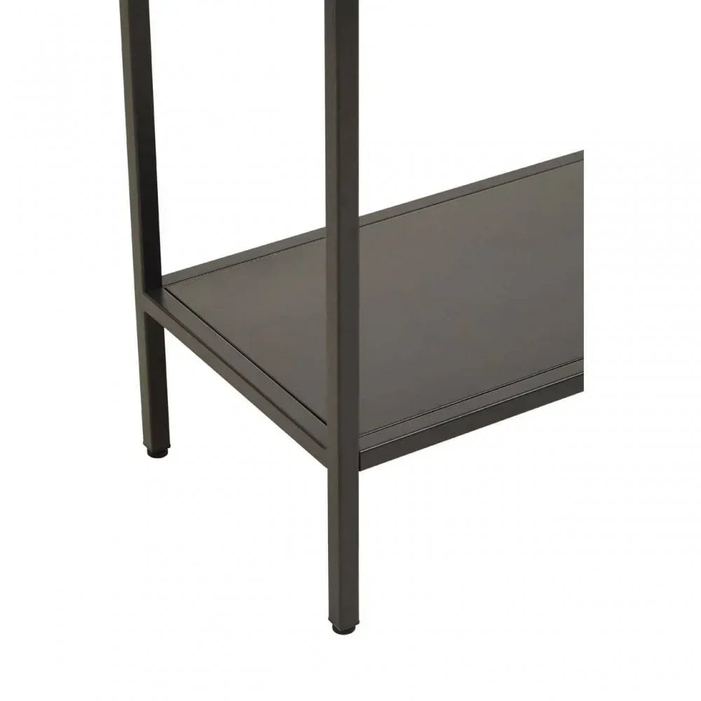 Black metal side table lower shelf and legs close-up