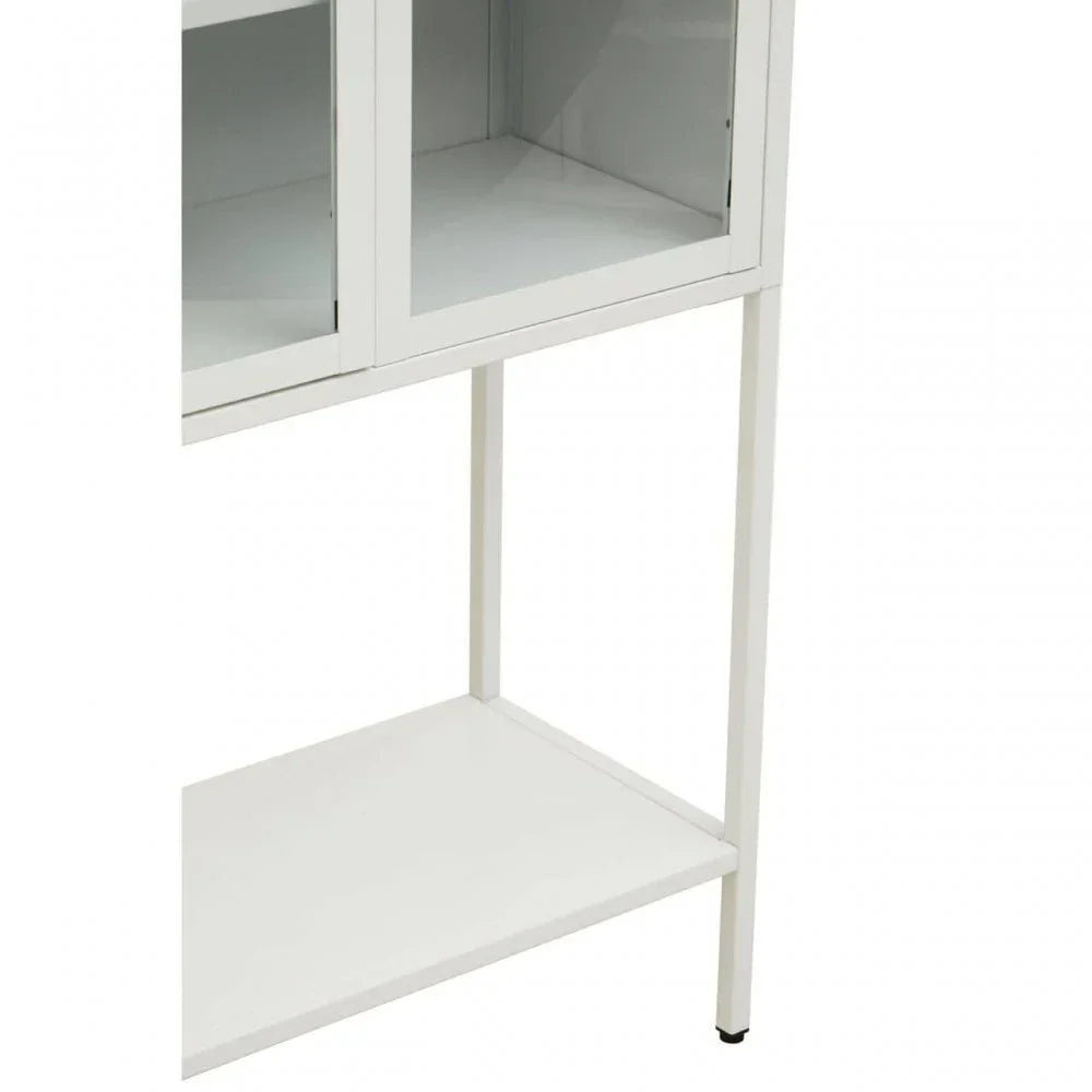 White storage cabinet with glass doors and metal legs, side angle view