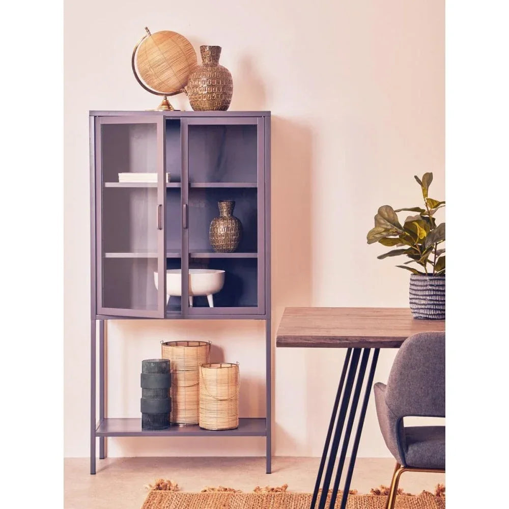 Modern glass display cabinet with shelves, decorative vases, dining table and chair nearby