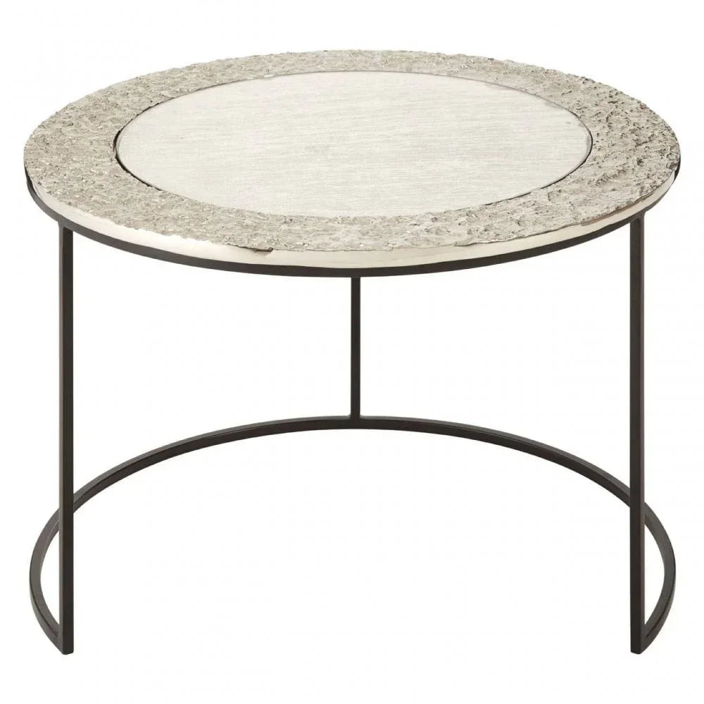 Round metal coffee table with textured silver top and slim black frame