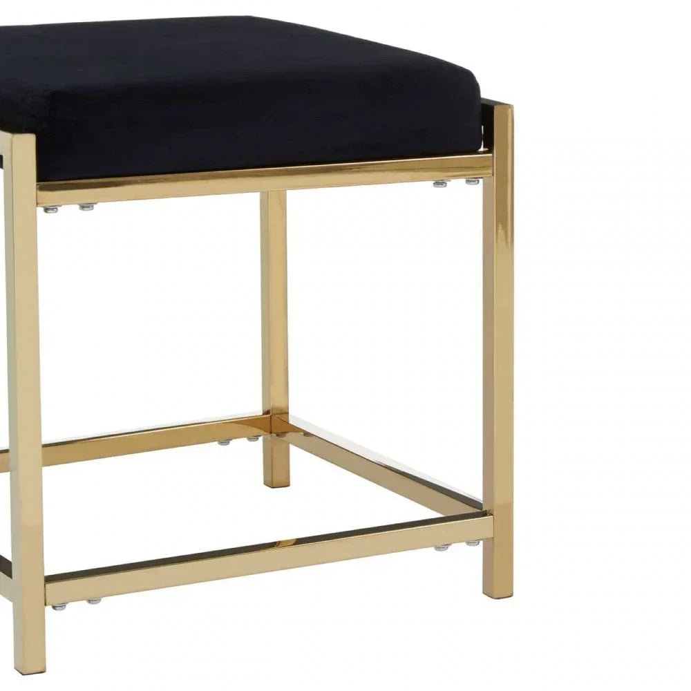 Black velvet stool with gold metal frame, corner angle view