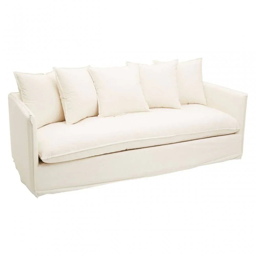 Cream fabric sofa with five matching cushions and box arms on white background