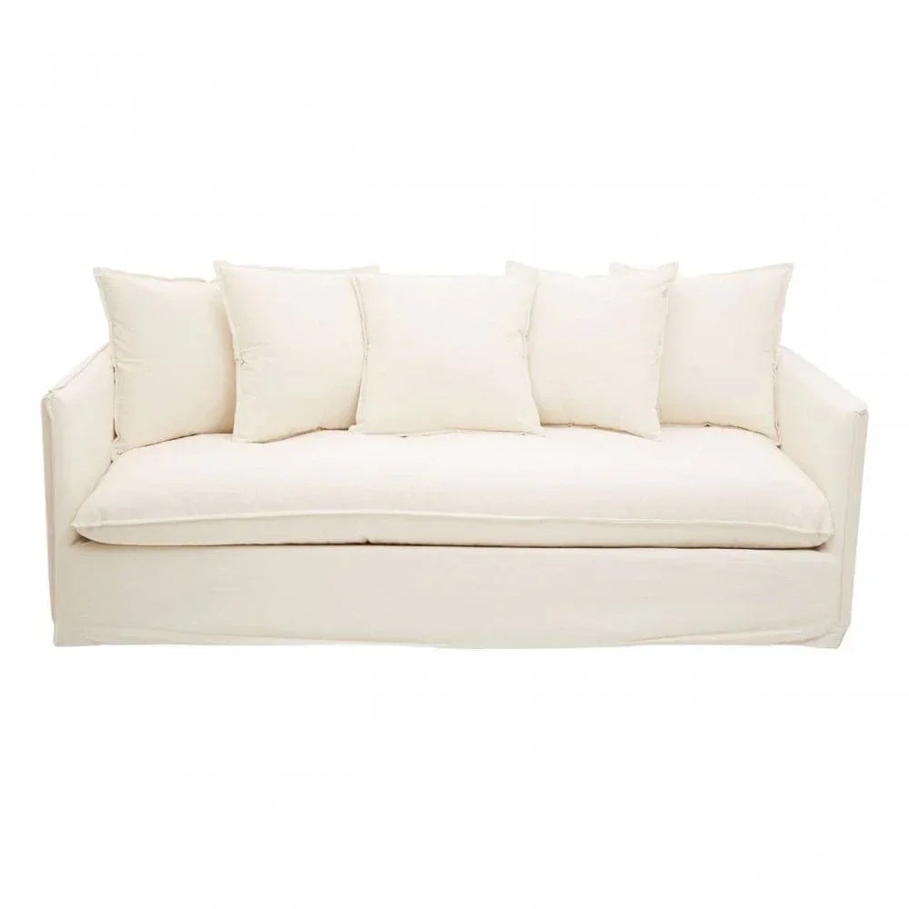 Cream fabric sofa with wide seat cushion and five matching scatter back cushions, front view