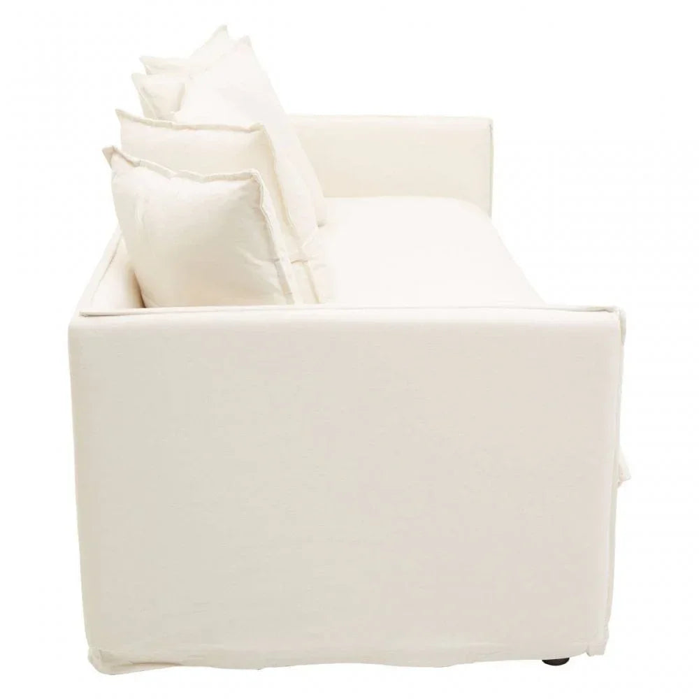 Side view of cream fabric sofa with three matching back cushions