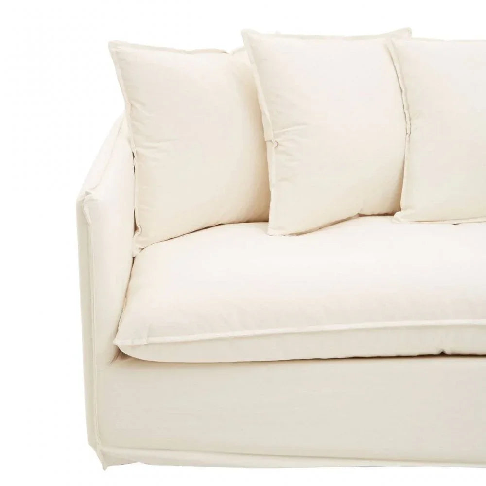 Cream fabric sofa with plush seat and three matching back cushions, left side view