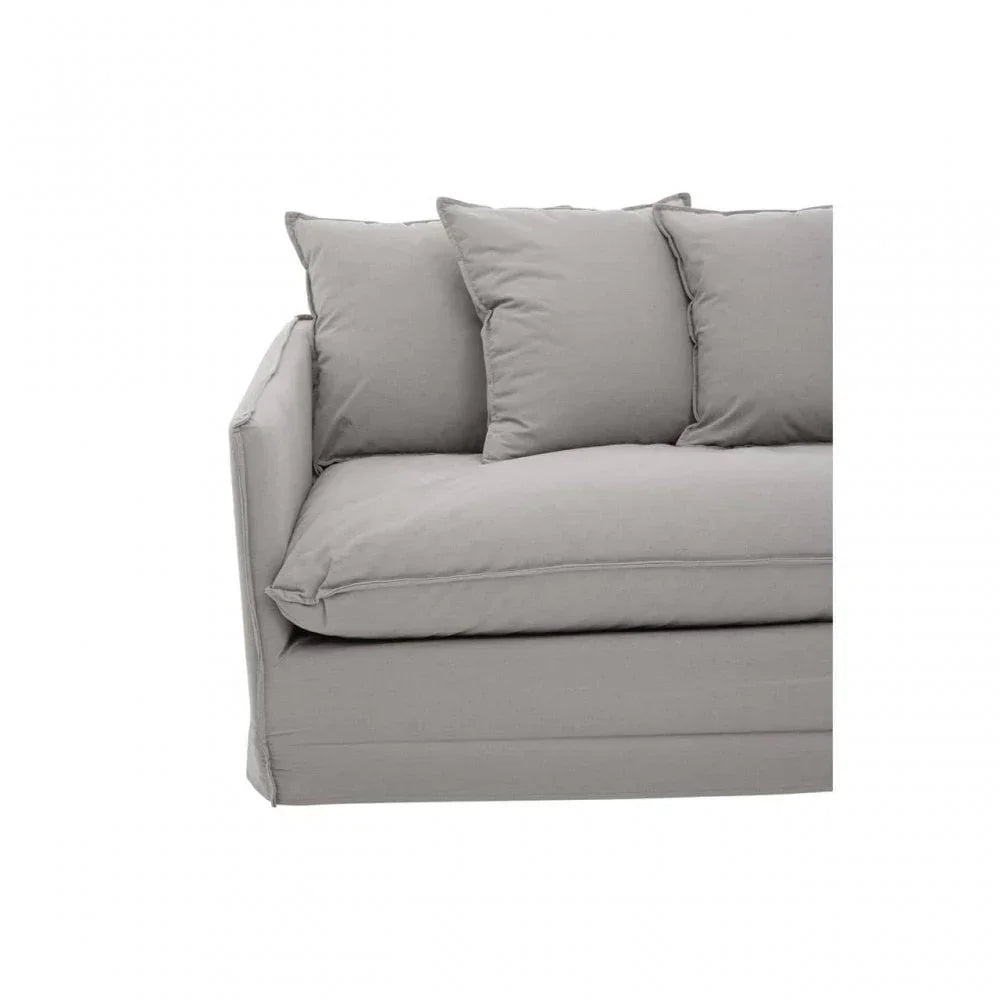 Light grey fabric sofa with three back cushions and deep seat, left armrest visible