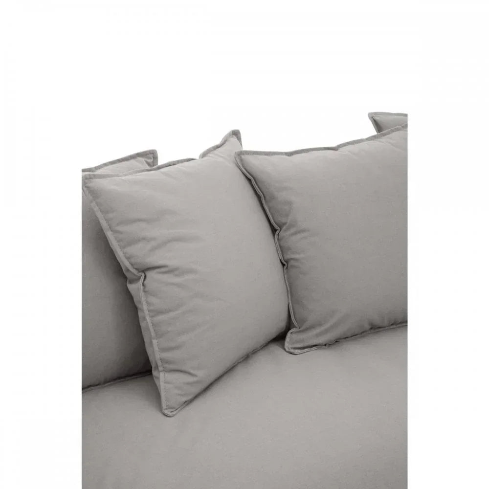 Light grey fabric sofa with large back cushions, close-up corner view