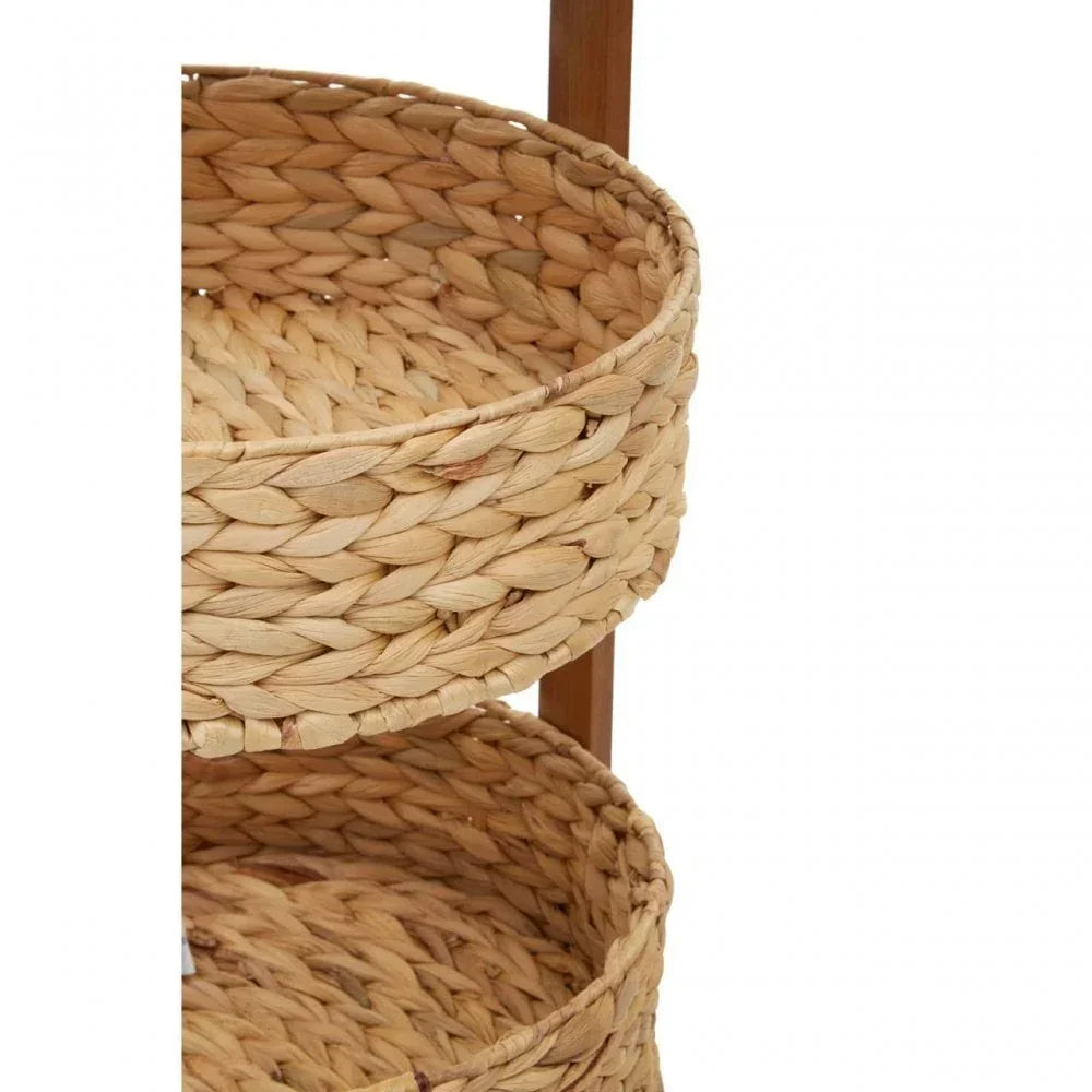 Closeup of two round woven seagrass storage baskets on wooden frame