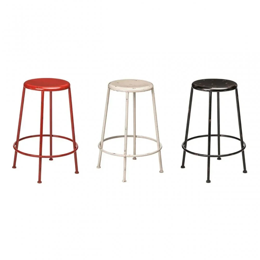 Set of three metal bar stools in red, white and black with round seats and footrests