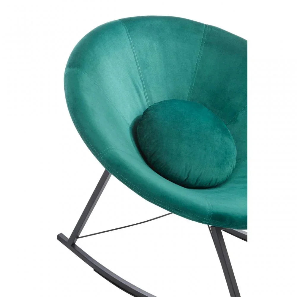 Teal velvet accent chair with round cushion and black metal frame, close-up view