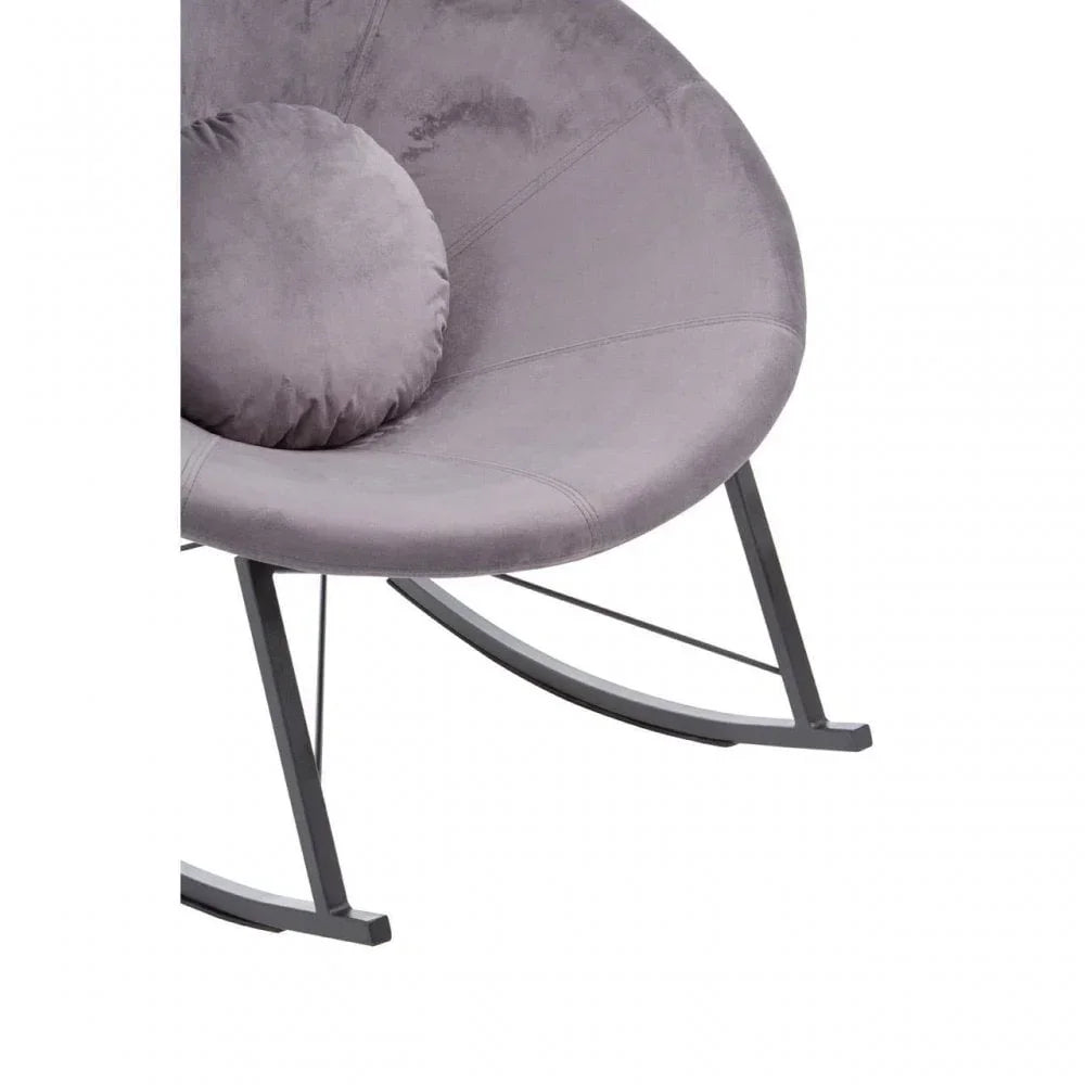 Grey velvet rocking chair with circular cushion and metal frame, partial side view