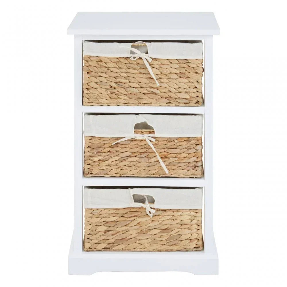White wooden storage unit with three wicker basket drawers and fabric liners