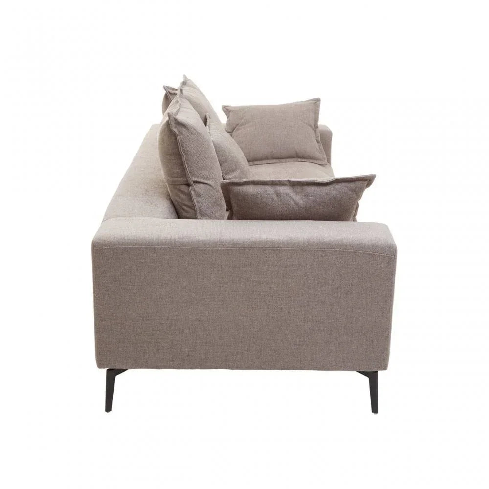 Side view of beige fabric sofa with cushions and slim black metal legs