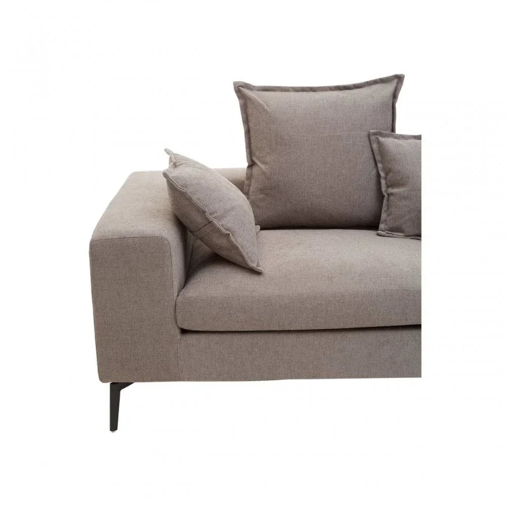 Corner view of beige fabric sofa with square cushions and black metal legs