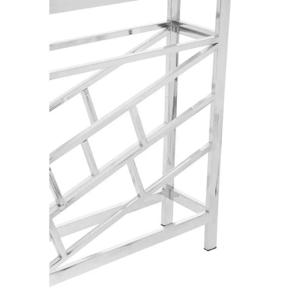 Closeup of chrome metal console table leg with geometric pattern detail