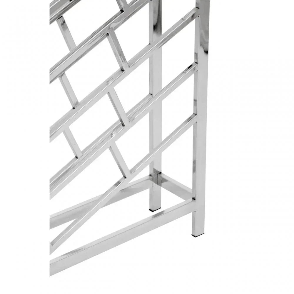 Closeup of chrome metal table leg with geometric lattice design