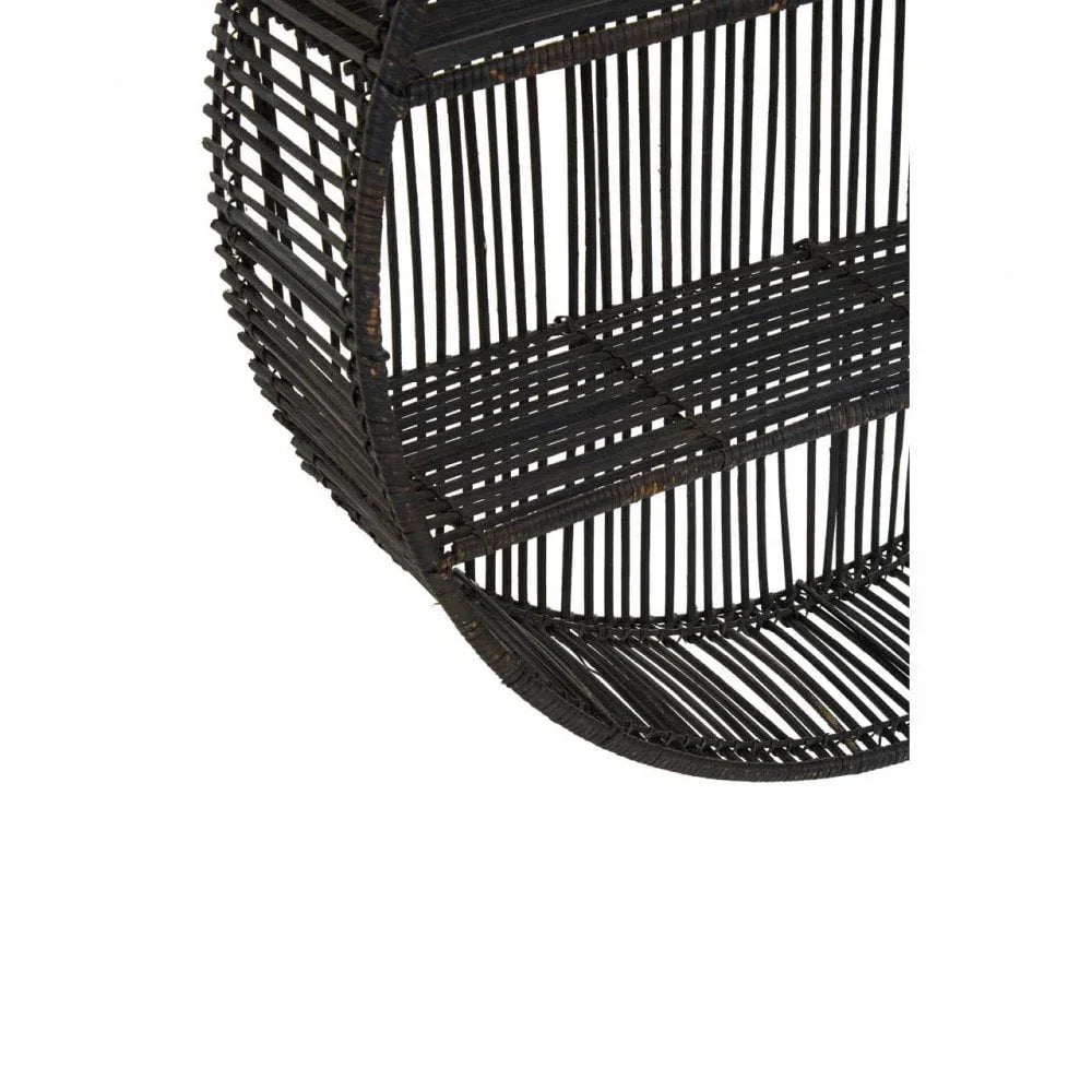 Close-up of round black rattan wall shelf with open slatted design and inner shelves