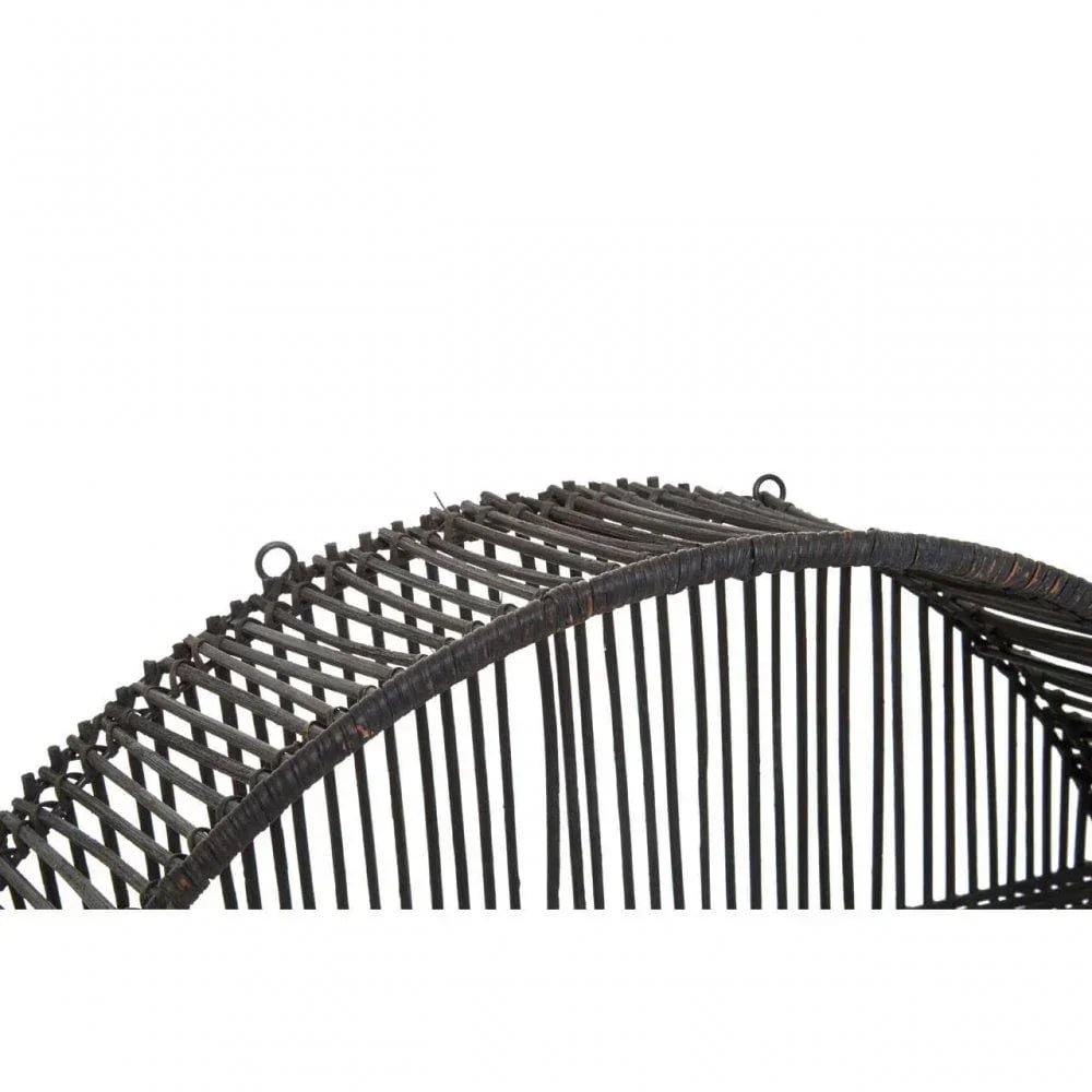 Curved black rattan furniture detail showing woven pattern and hooks for hanging