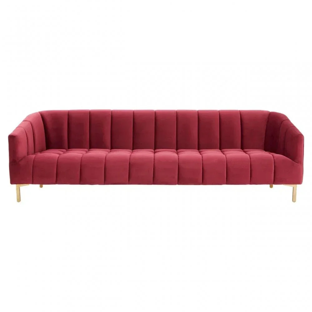 Red velvet sofa with vertical channel tufting and wooden legs, front view