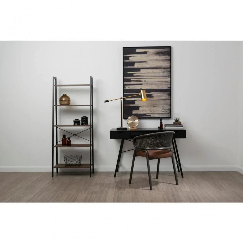 Modern home office desk set with black chair and metal shelving unit against white wall