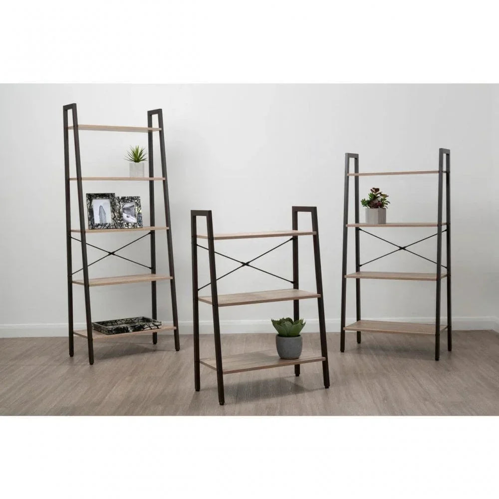 Set of three wood and metal shelving units with decorative items on wooden floor