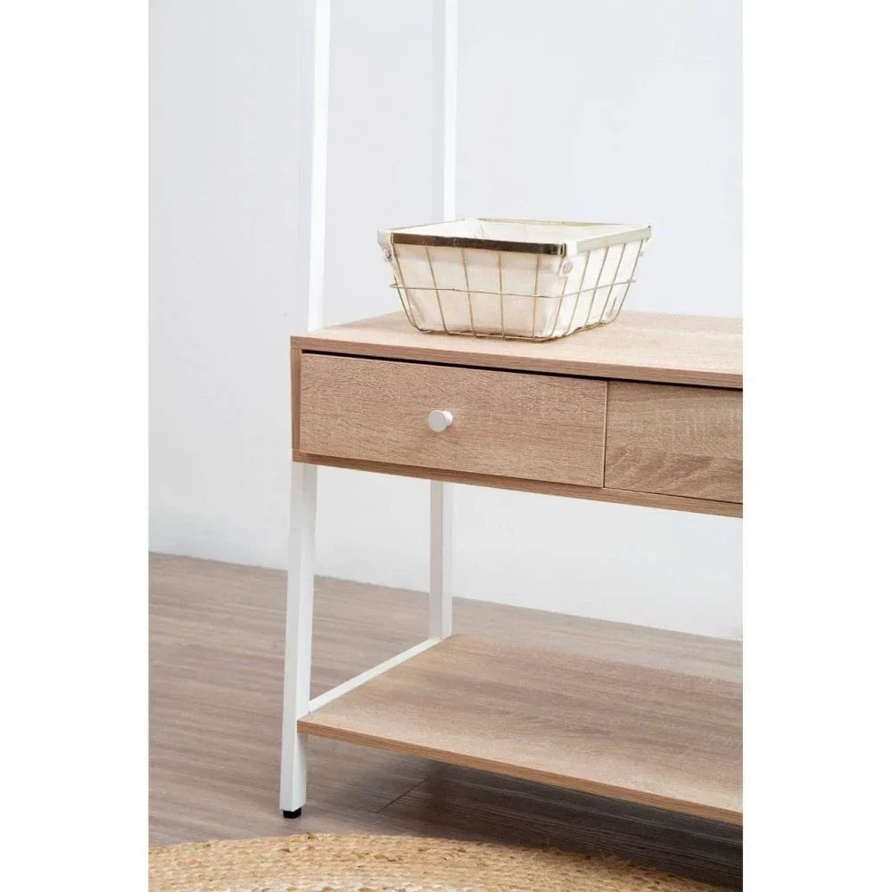 Light wood console table with drawer, shelf, and white metal frame in modern room