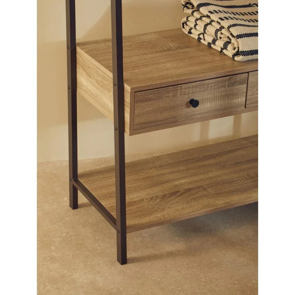 Wood console table with metal frame, drawer and shelf, folded striped blankets on top