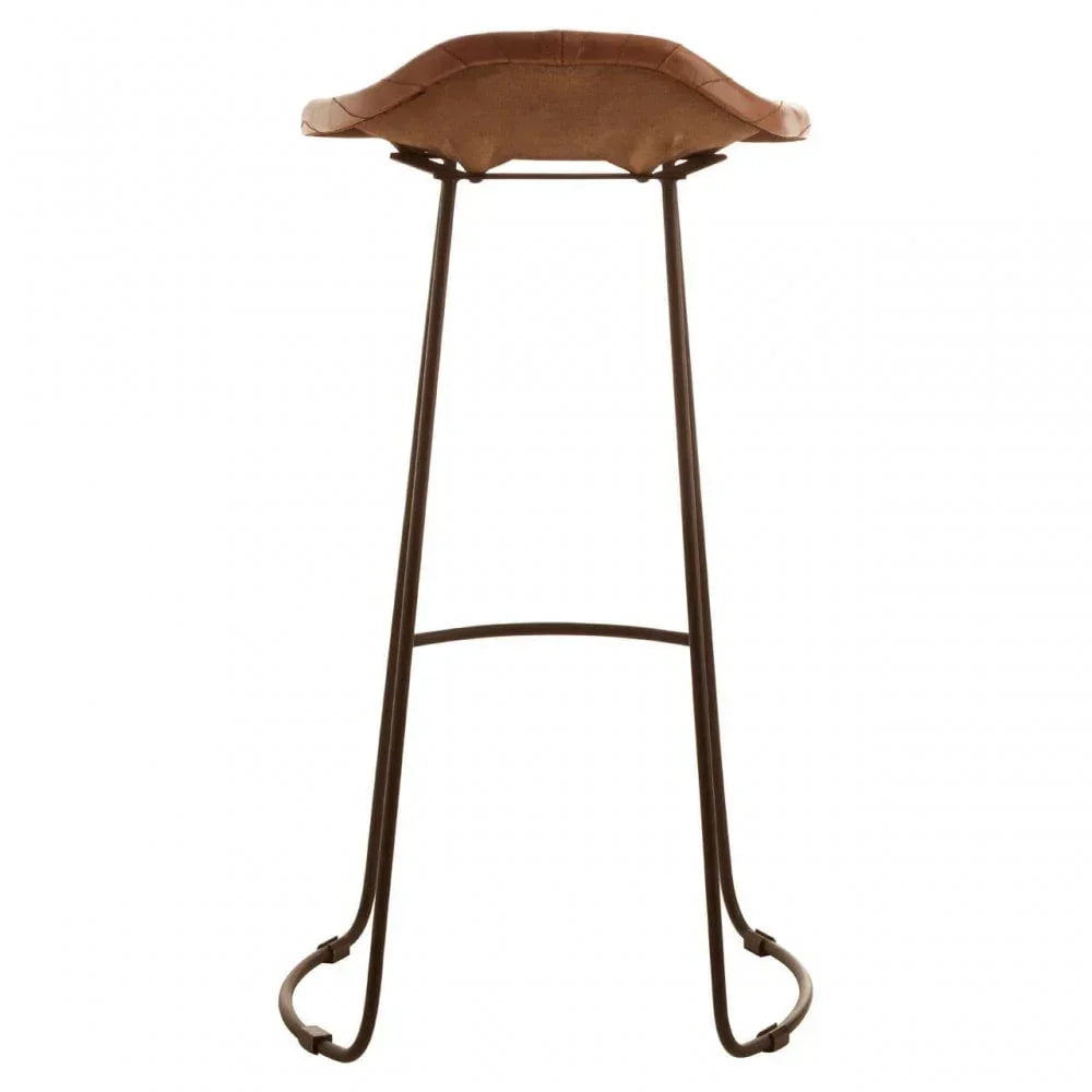 Brown leather bar stool with curved metal legs and saddle seat, back view