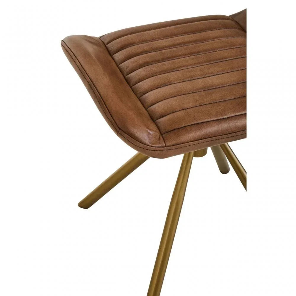 Brown leather dining chair with ribbed seat and gold metal legs, angled side view