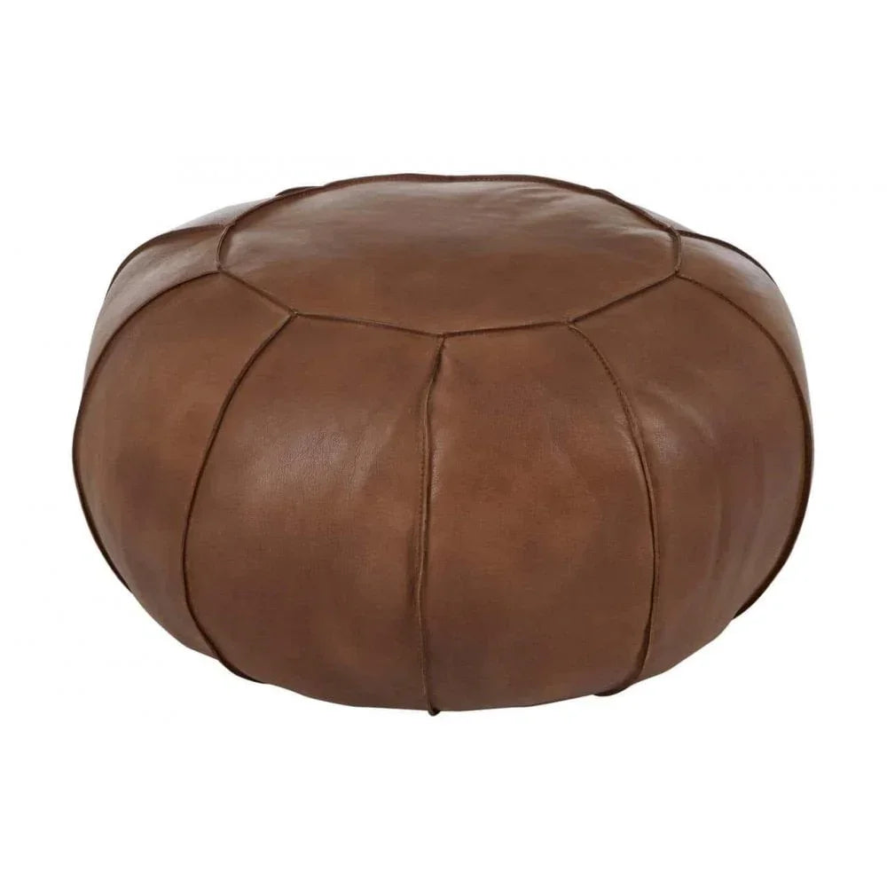 Round brown leather pouffe with stitched panel design on white background