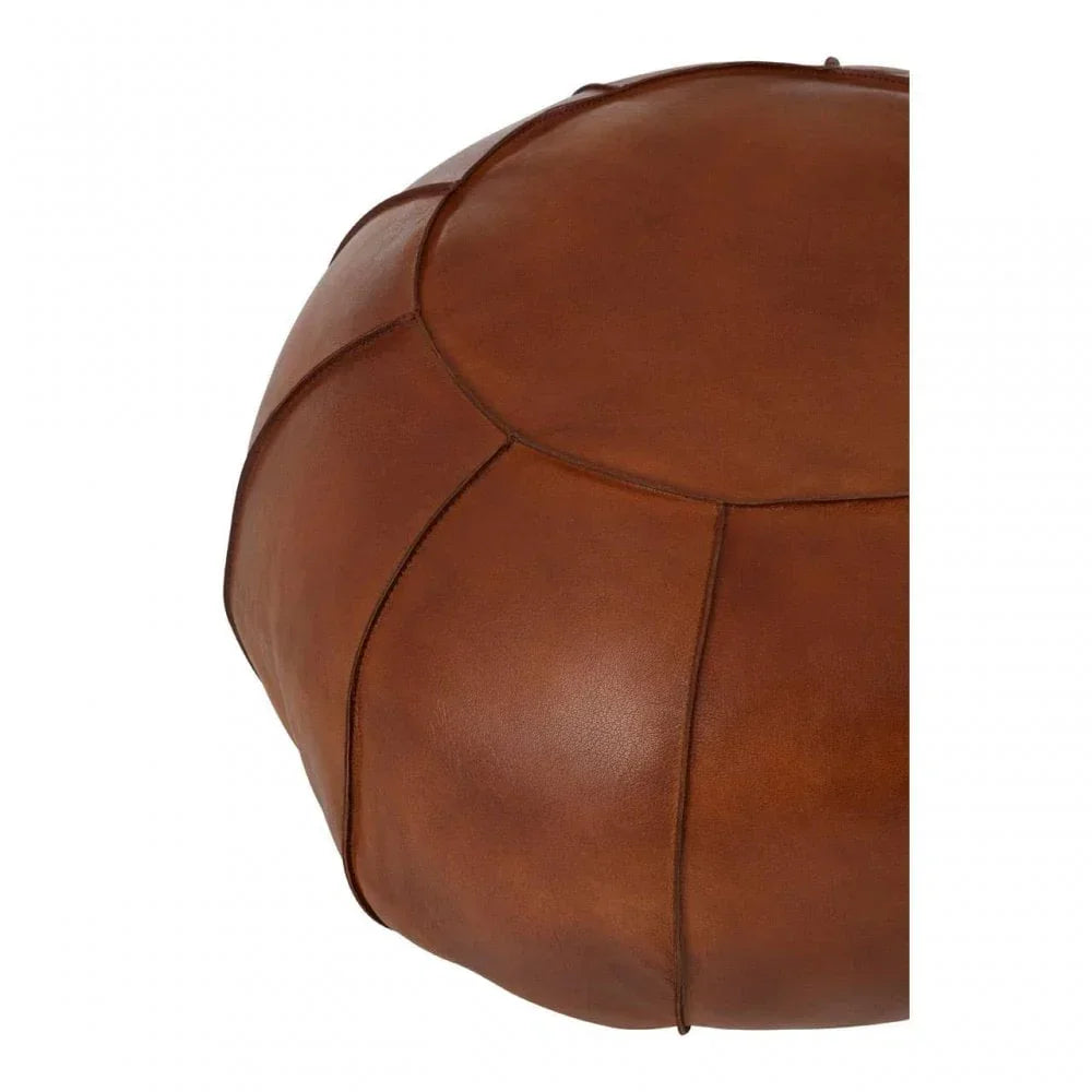 Round brown leather pouffe with stitched panel detail, close up view