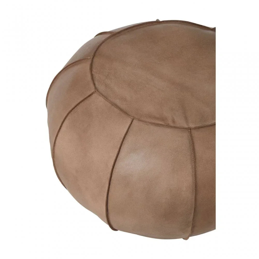Brown leather pouffe with stitched panel design, close-up view of upholstery texture