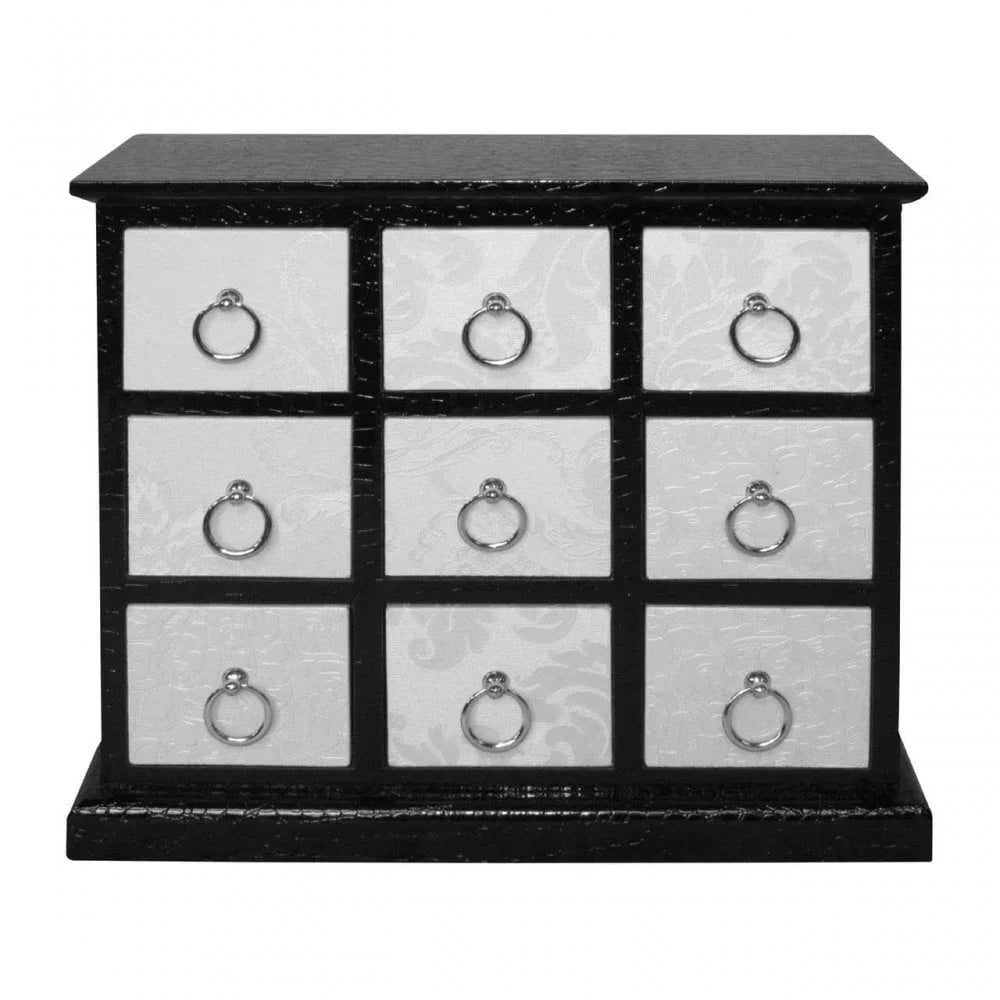 Black and white nine-drawer chest with silver ring handles and embossed drawer fronts