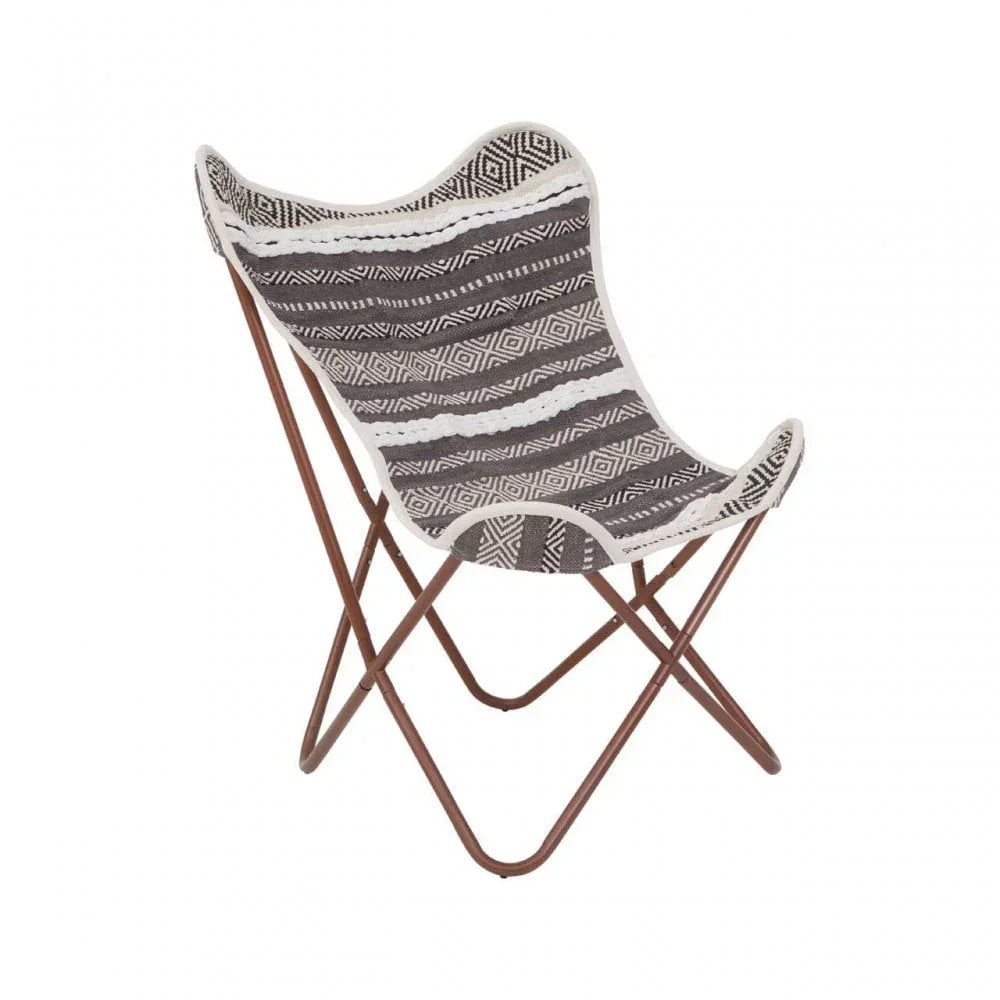 Butterfly chair with black and white patterned fabric seat and brown metal frame