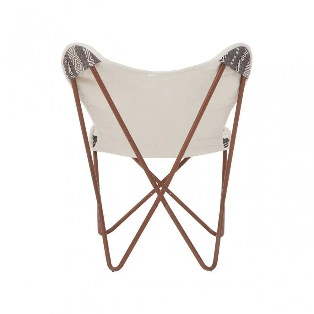 Butterfly chair with beige fabric seat, brown metal frame and patterned corners, rear view