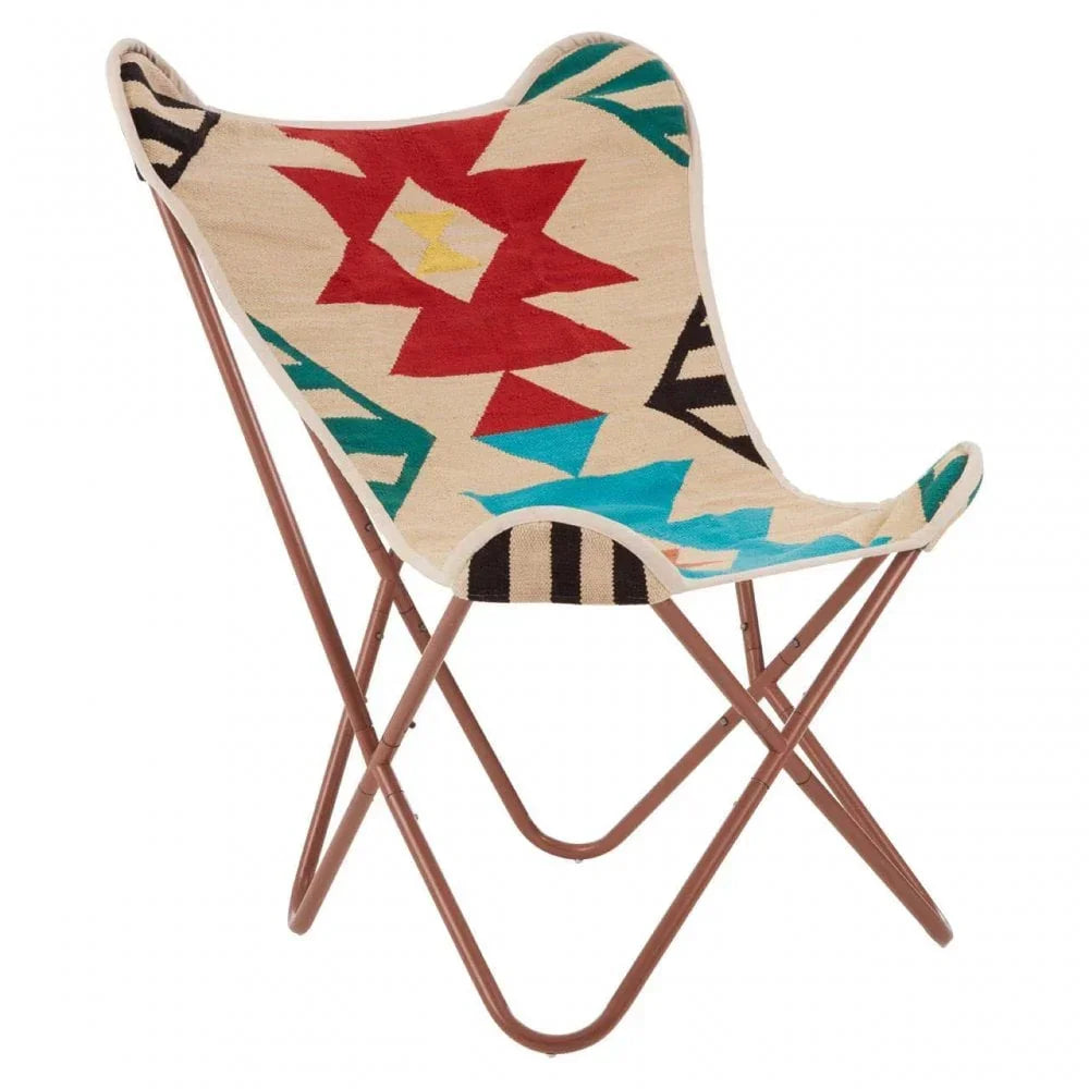 Butterfly chair with brown metal frame and geometric multicolor fabric seat