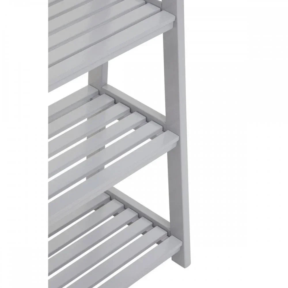 White wooden shelving unit with slatted shelves, side view close-up
