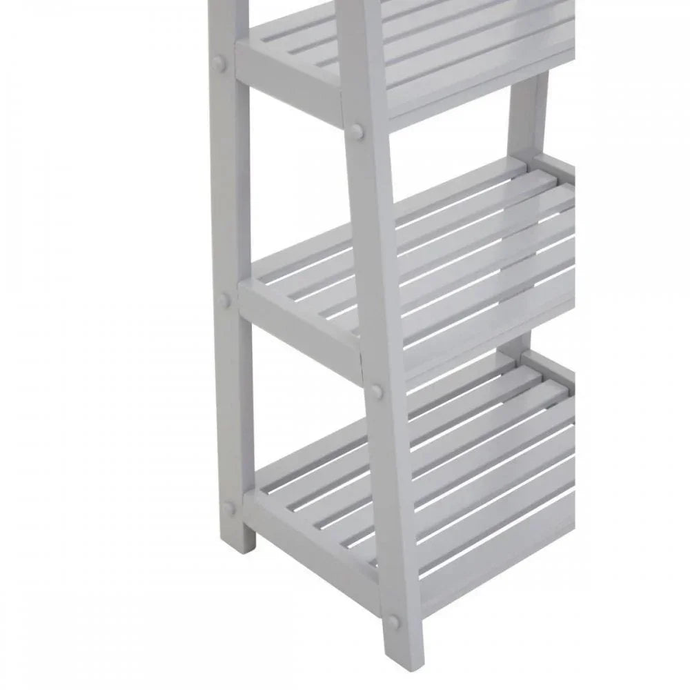 White wooden ladder shelf with slatted tiers, close-up of shelving details