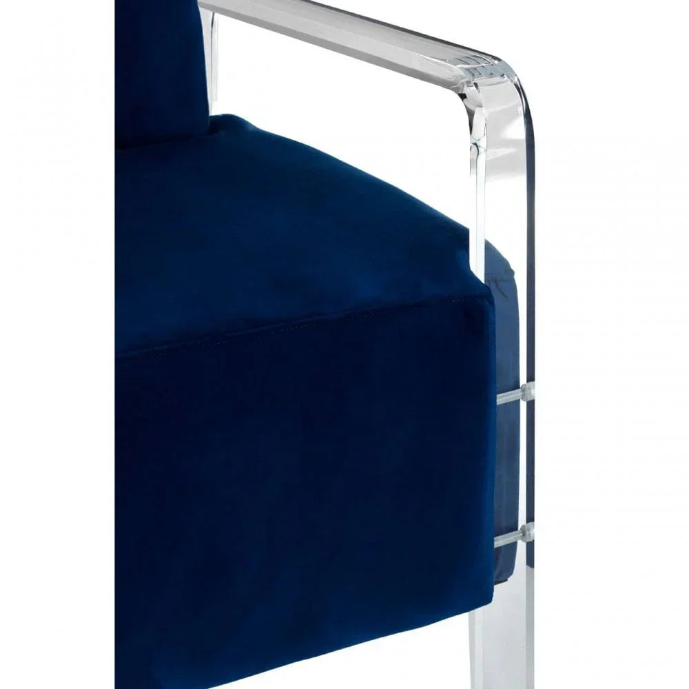 Blue velvet armchair with clear acrylic armrest closeup