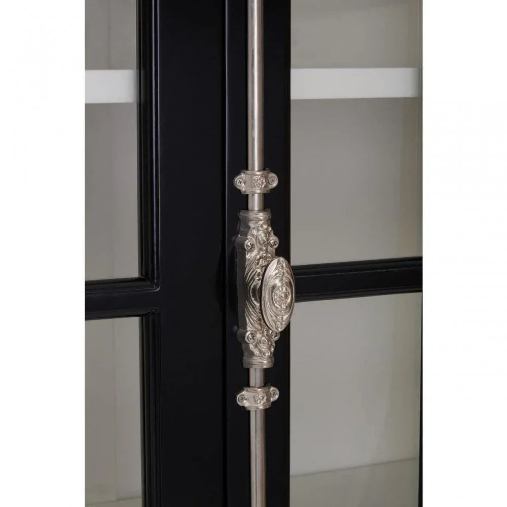 Black display cabinet door with ornate silver handle and glass panel